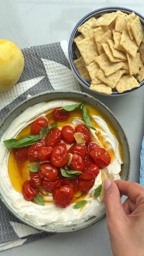 Instagram post by @feelgoodfoodie for Crunchmaster Crackers. Caption reads: [...] tomatoes served with the new....