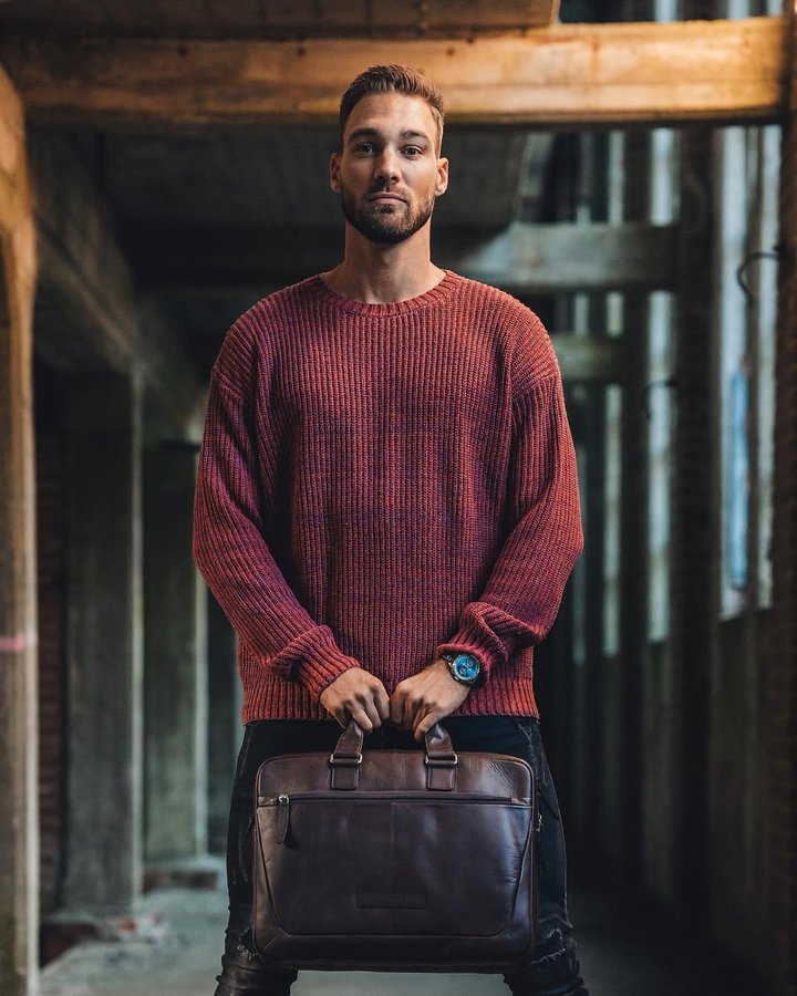 Instagram post by @kjeldnuis for The Chesterfield Brand. Caption reads: 🧳🤎.