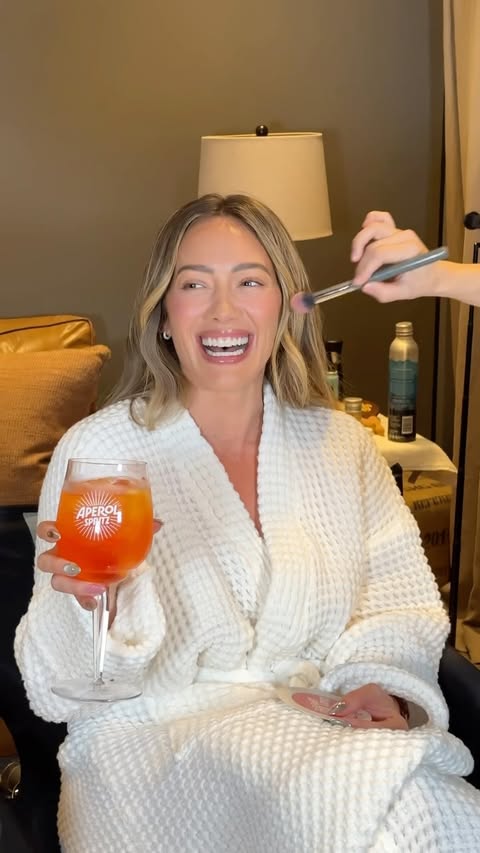 Instagram post by @hilaryduff for Aperol Spritz. Caption reads: from soundcheck to Aperol Spritzes 🍊 Thank you LA....