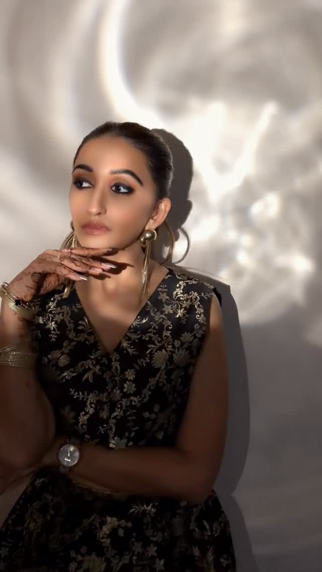 Instagram post by @lovelyarora_fashionicongreece for Shoppers Stop. Caption reads: Golden glimmers, black elegance — Diwali glow....