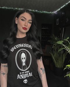 Instagram post by @nicnakkkk for Zavvi. Caption reads: I’ll stop wearing black when they make a darker....