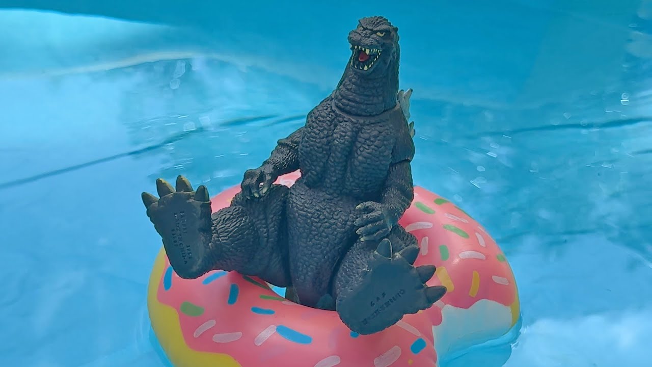 YouTube post by @MonsterIslandBuddies for Zazzle. Caption reads: Godzilla vs. the Water Park.