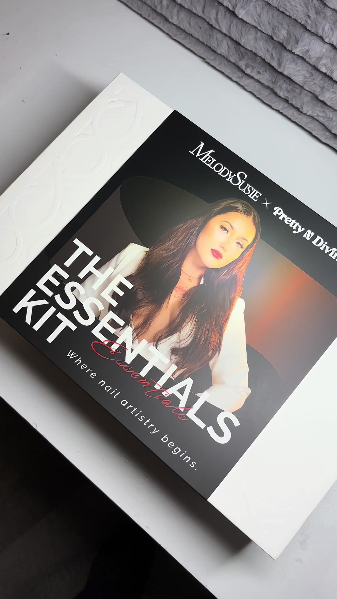 TikTok post by @prettyndivinebeauty for MelodySusie. Caption reads: The Essentials Kit is LIVE — where nail artistry....