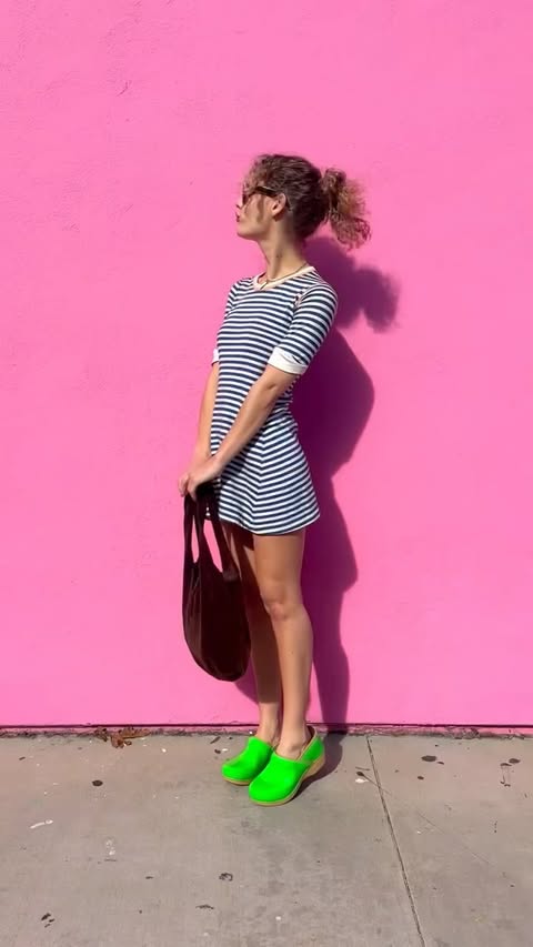 Instagram post by @partyatlouises for Dansko. Caption reads: 💛 step into color 🩷 @dansko XP 2.0 Neon Clogs ....