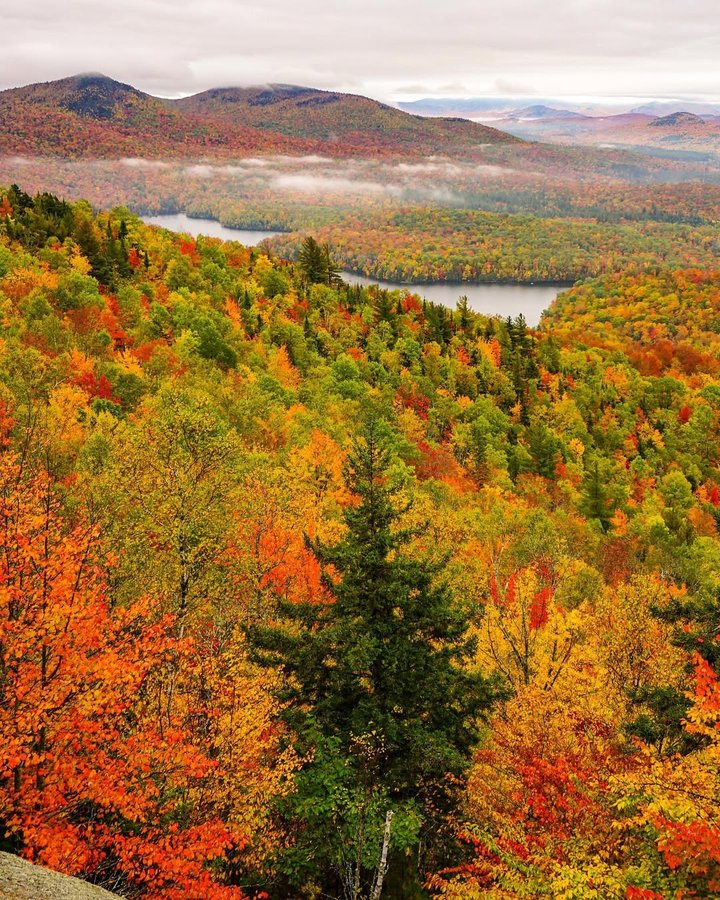 Instagram post by @lukekellytravels for National Geographic Travel. Caption reads: Heading up to the Adirondacks for some quiet this....