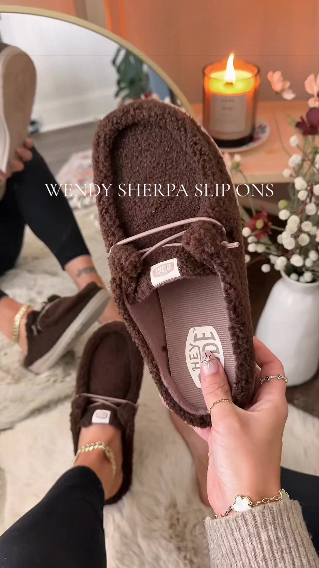 TikTok post by @alygraphs for Hey Dude Shoes. Caption reads: [...] disguised as a slipper 🧸🤎 @HeyDude....