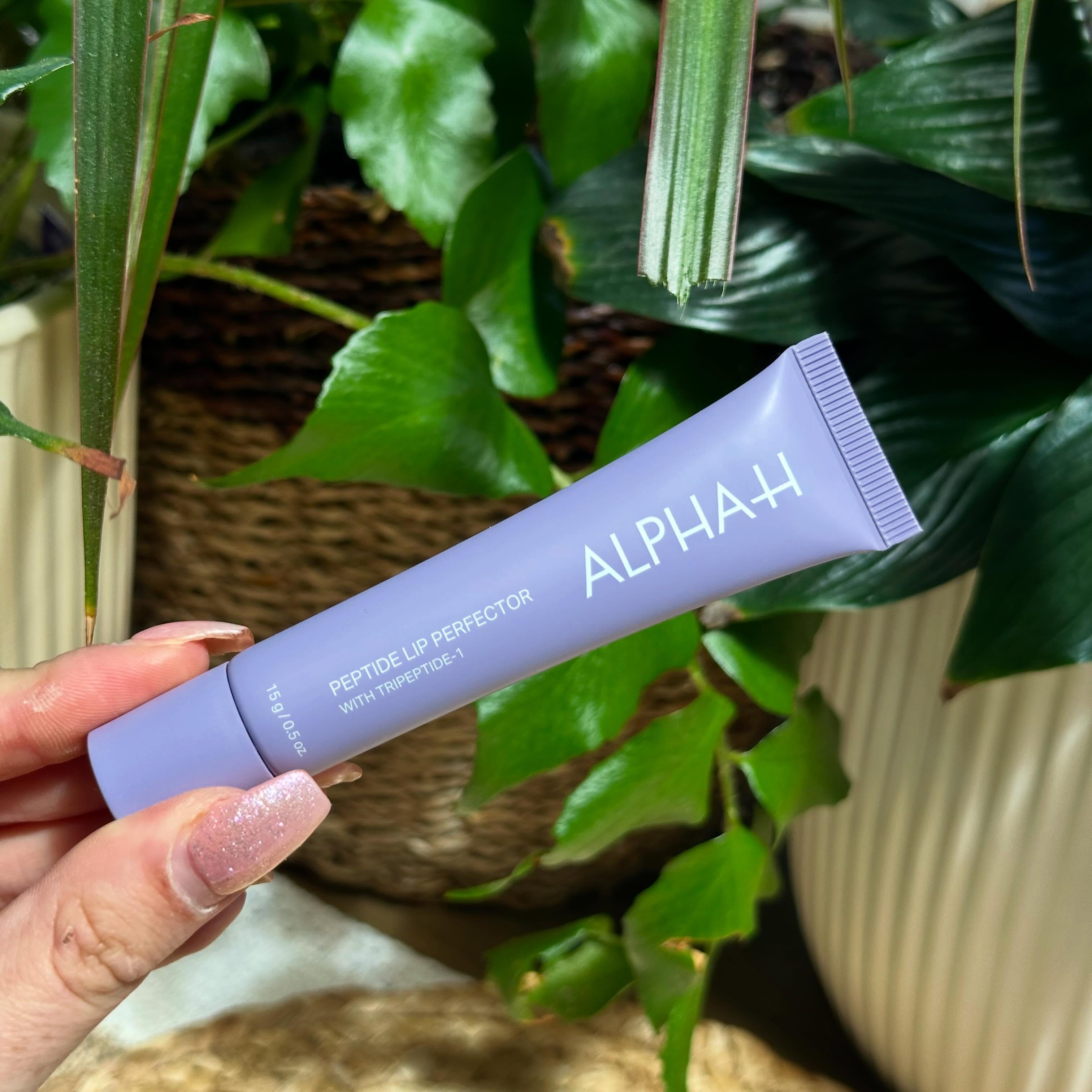 Instagram post by @themichelleedit for ALPHA-H. Caption reads: [...] I’ve been loving this lip product from....