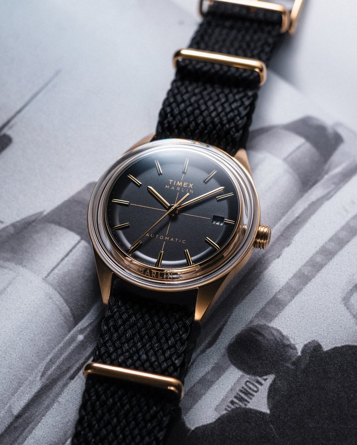 Instagram post by @averagewatches for Timex. Caption reads: Something about a gold watch that makes you stand....