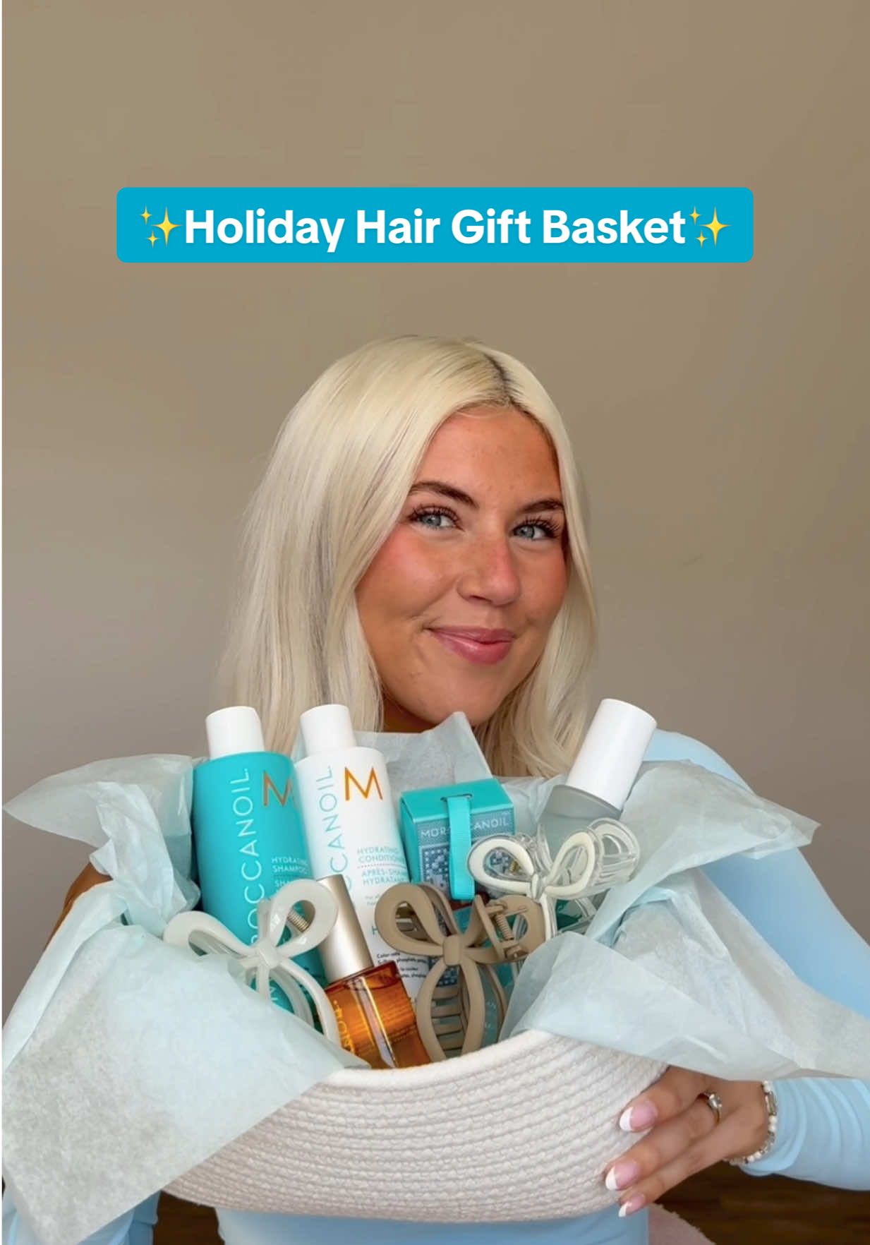 TikTok post by @taylor_pfeffer for Moroccanoil. Caption reads: The cutest holiday hair gift basket idea 🥰 I put....