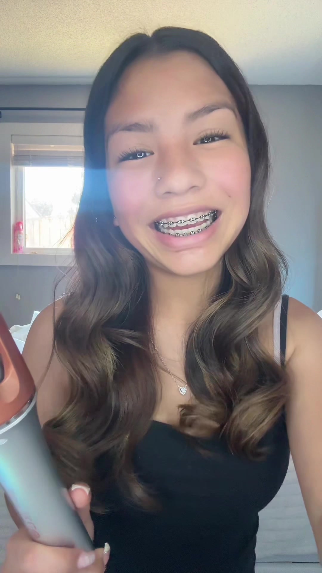 TikTok post by @natistyless_ for SHEGLAM. Caption reads: Trying the new curling iron #fyp #sheglam....