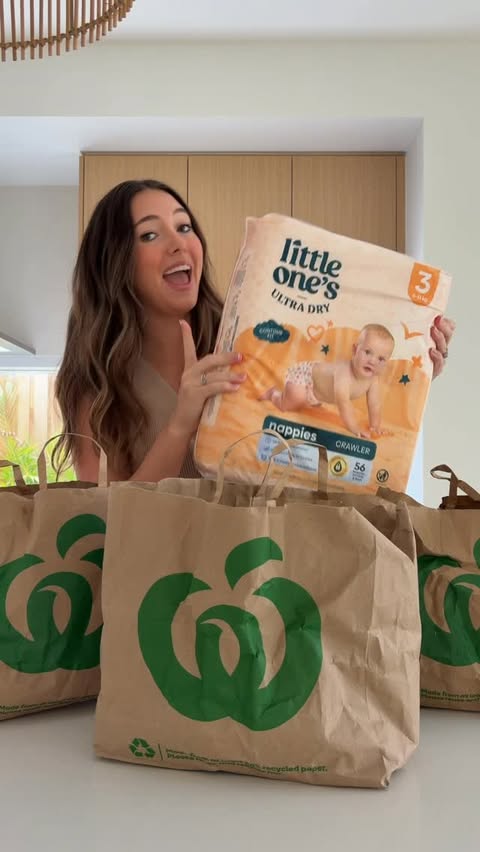 Instagram post by @katelynn.young for Woolworths. Caption reads: [...] a leaking nappy so I decided to put....