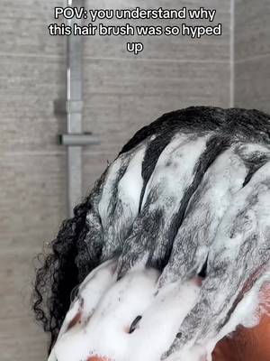 TikTok post by @atarahstouch for Unbrush. Caption reads: [...] in the shower just makes more sense 🤩....