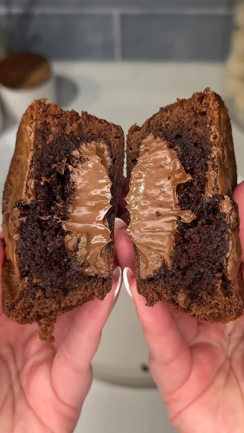 Instagram post by @ashleymarkletreats for Nutella. Caption reads: once you try these nutella stuffed brownies you....