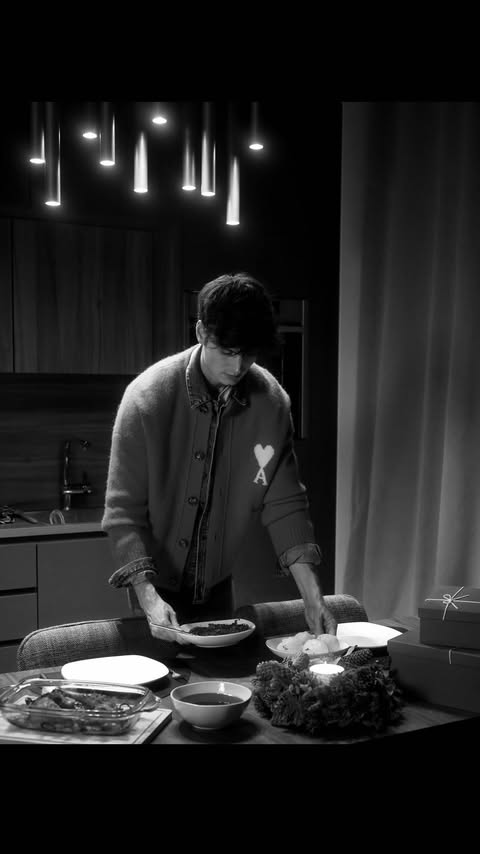 Instagram post by @moritz_hau for AMI Paris. Caption reads: Holiday Delights with @amiparis ad.