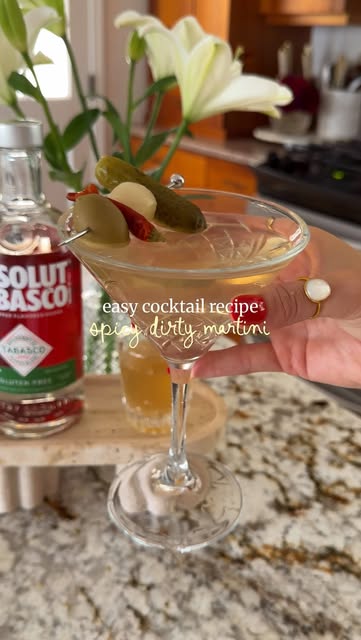 Instagram post by @sugaredstilettos for Absolut. Caption reads: [...] easiest spicy dirty martini 🌶️🍸 2 oz....