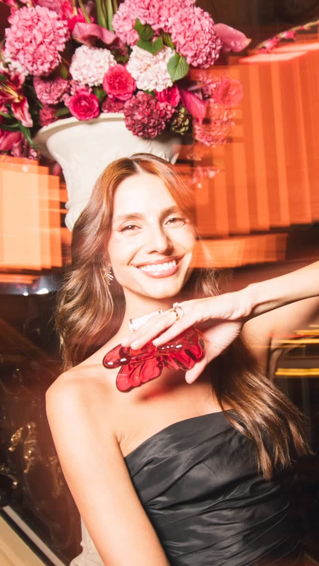 Instagram post by @ilianapapageorgiou for Carolina Herrera. Caption reads: Wrapped in the rhythm of Madrid, under the spell....