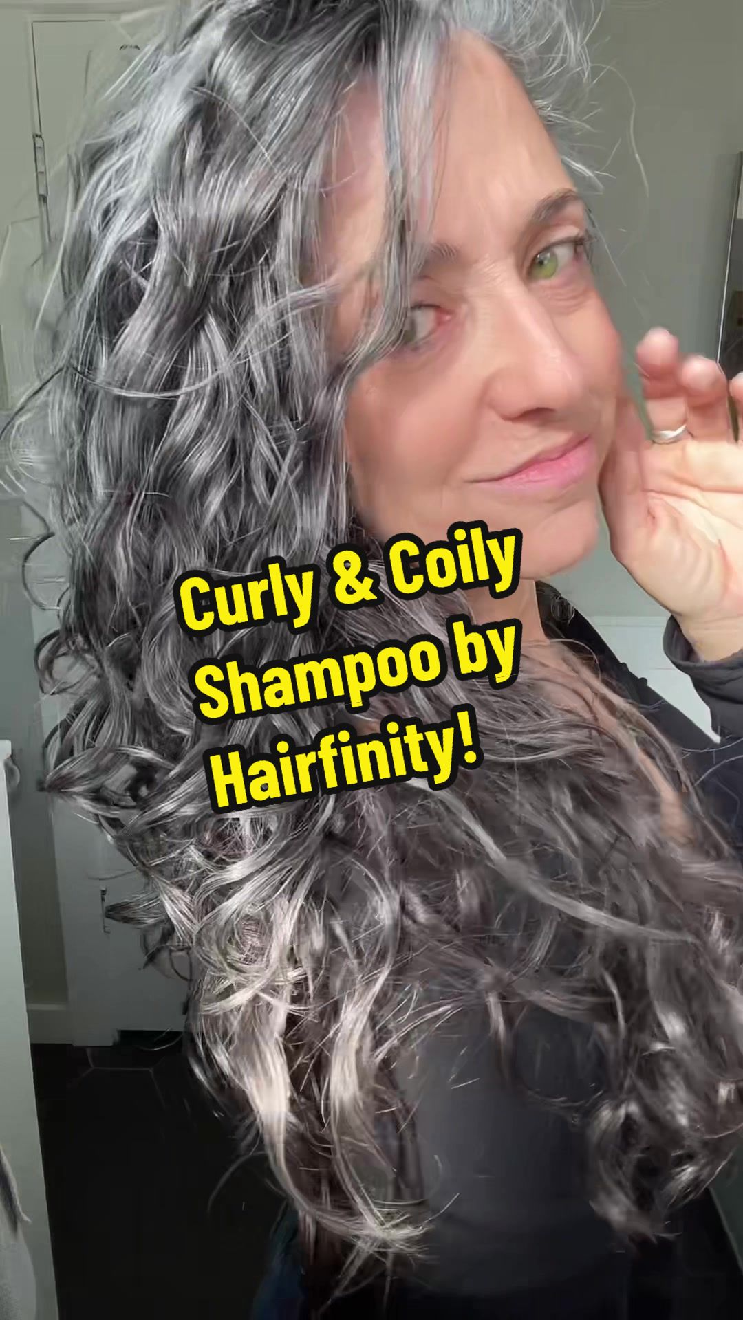 TikTok post by @grayawhile for Hairfinity. Caption reads: [...] to love the Curly & Coily Shampoo by....