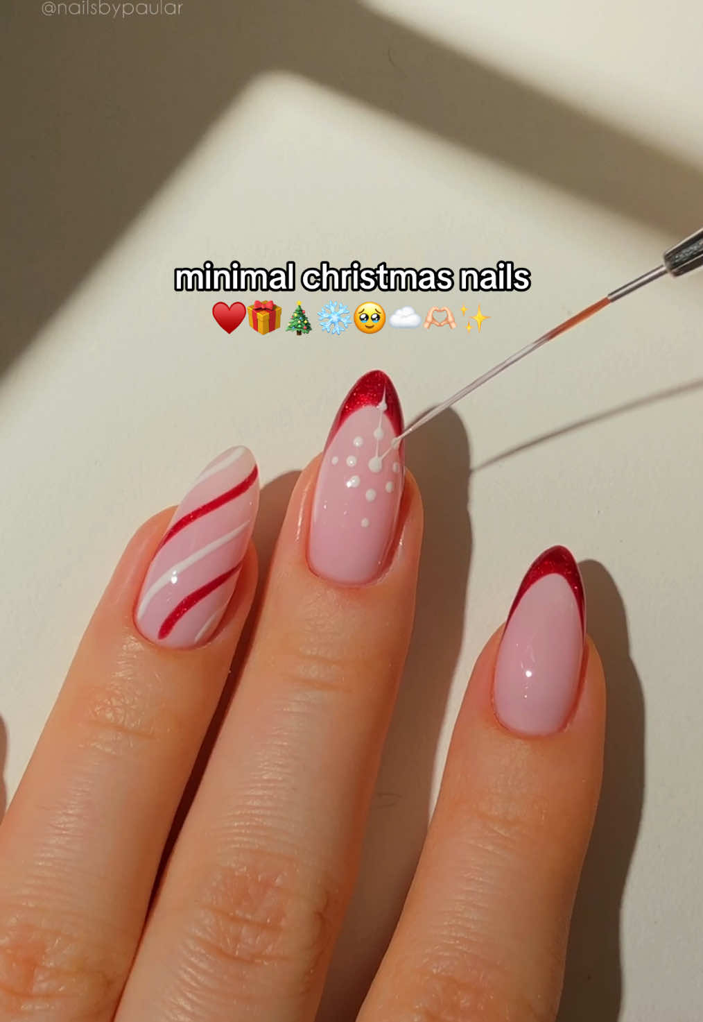 TikTok post by @nailsbypaular for MelodySusie. Caption reads: minimal christmas nails! ♥️🎄🎁 a deep, sparkly....