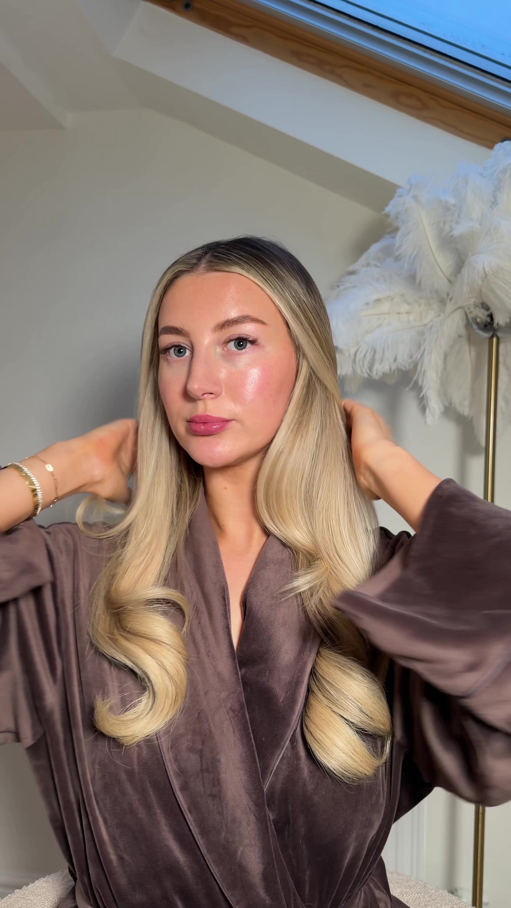 TikTok post by @amelia0livia for BeautyWorks. Caption reads: Ad How to do a curly bouncy blow dry without a....