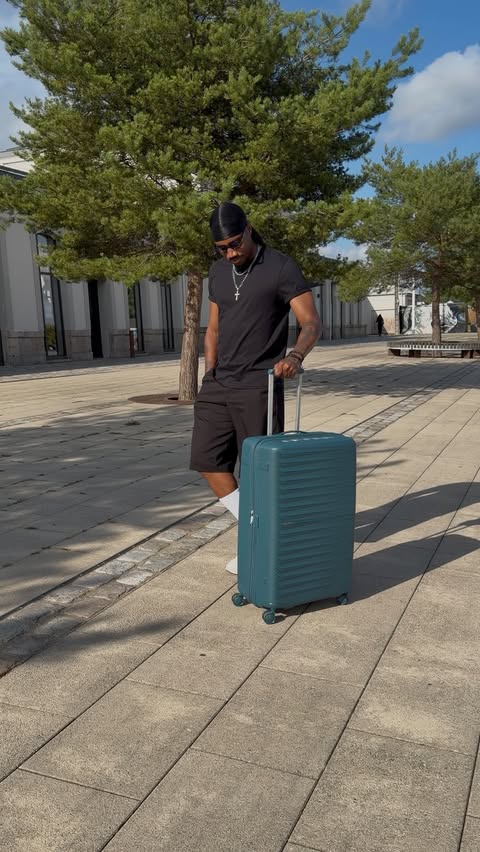 Instagram post by @evansmonney03 for American Tourister. Caption reads: A departure, a destination, and my American....