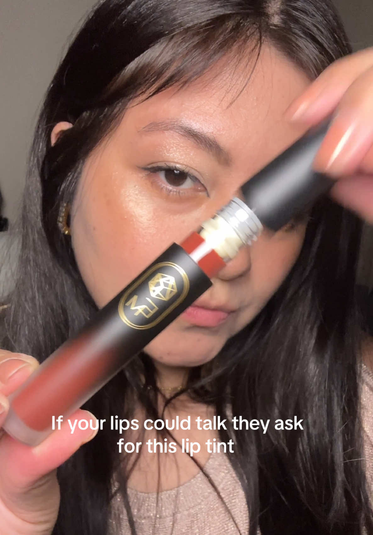TikTok post by @lissetbeauty for EM Cosmetics. Caption reads: [...] like you have nothing on your lips! @EM....