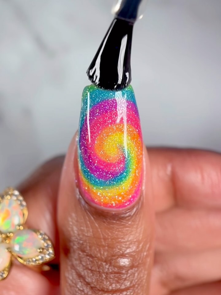 Instagram post by @suziemoon626 for Holo Taco. Caption reads: 🌈✨ Rainbow Nail Art ✨🌈
1 or 2. Which one do you....
