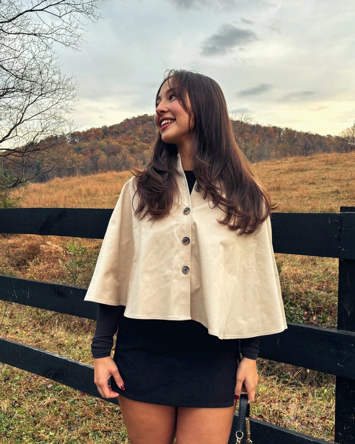 Instagram post by @legswithshmegs for LOFT. Caption reads: give me a trench poncho and mountain getaway....