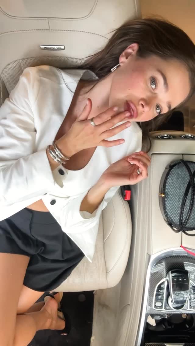 Instagram post by @valerialipovetsky for John Hardy. Caption reads: This is your sign to romanticize the car mirror....