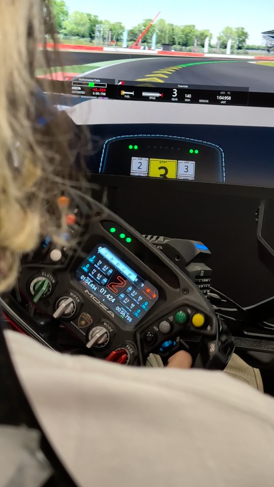 Instagram post by @jimmy_broadbent for MOZA Racing. Caption reads: Flashback to @gamescom where I did my best not to....