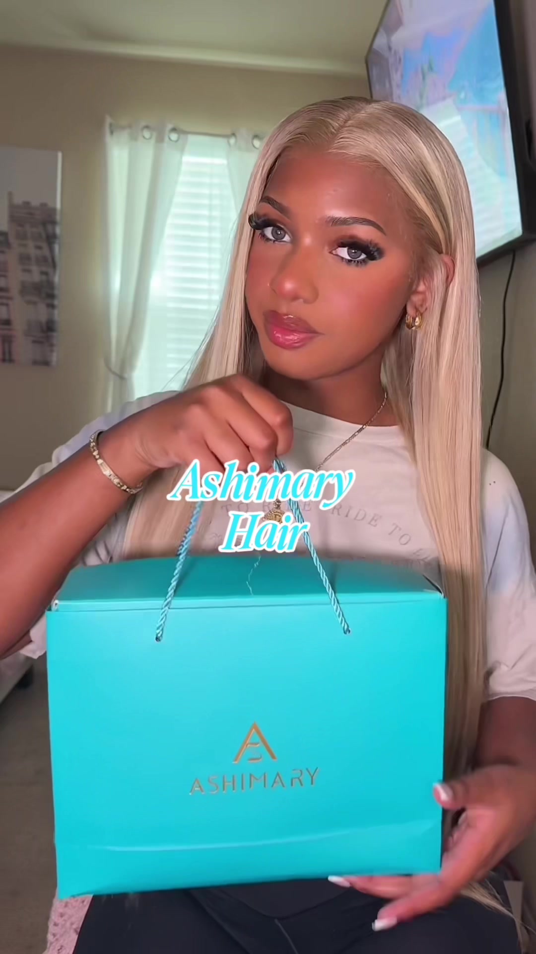 TikTok post by @wh0ism4ri for Ashimary Hair. Caption reads: Blonde has never looked better!! thank you....