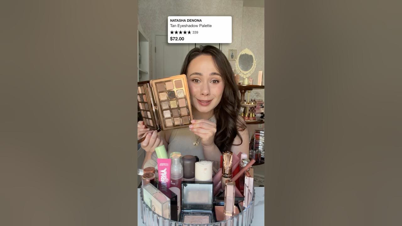 YouTube post by @MorganTurnerMakeup for BUXOM Cosmetics. Caption reads: ▶ Mentioned Natasha Denona Tan Palette Marc Jacobs....