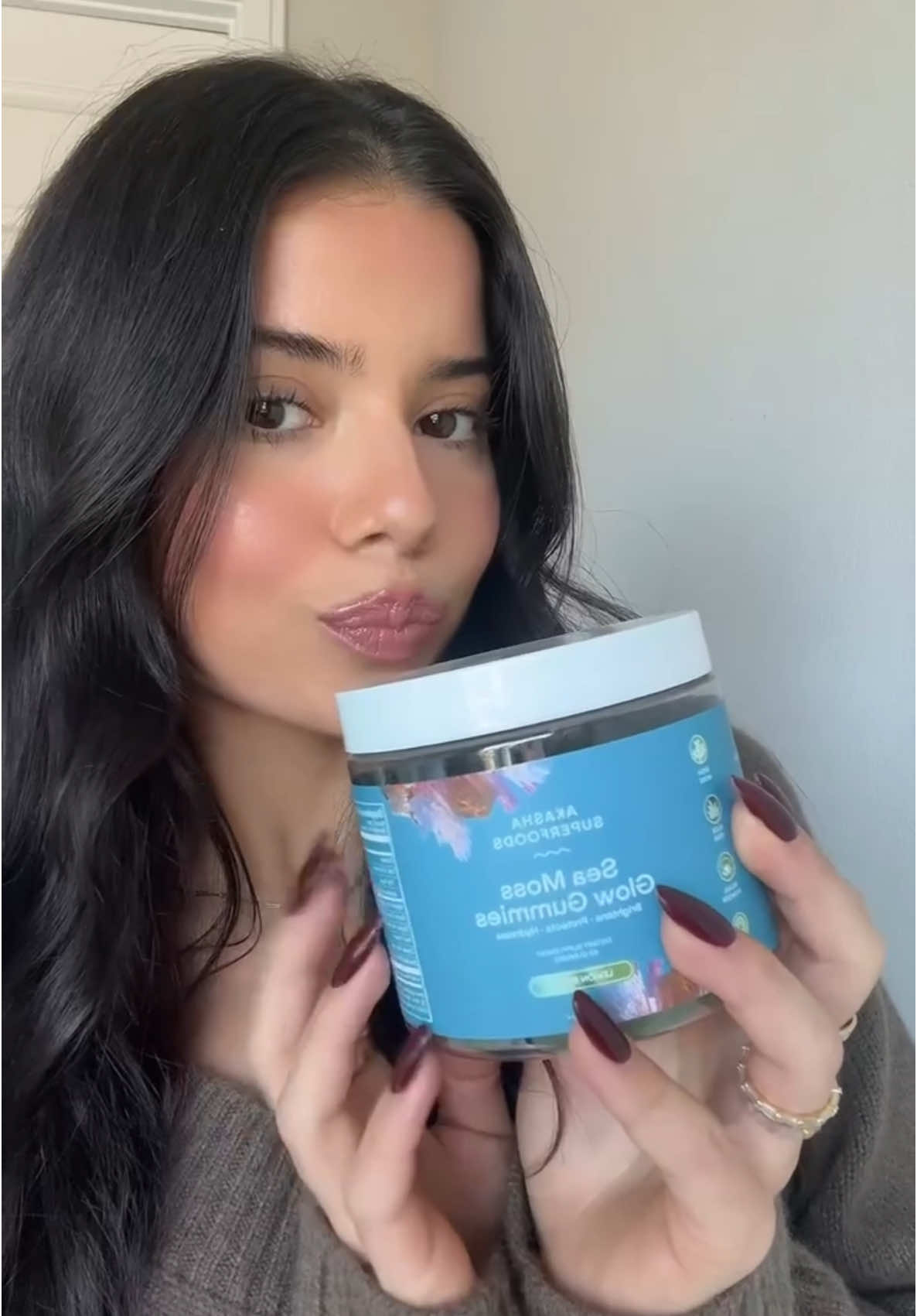 TikTok post by @elenamiaou for Akasha Superfoods. Caption reads: [...] daily supplements for clear skin @Akasha....