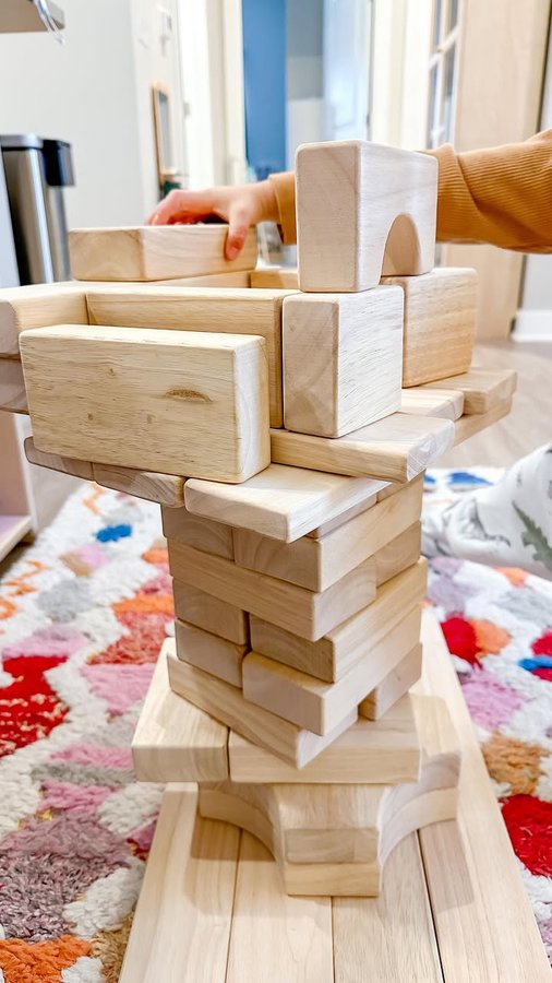 Instagram post by @a.calm.mom for Guidecraft. Caption reads: A parenting paradox: As untidy as young children....