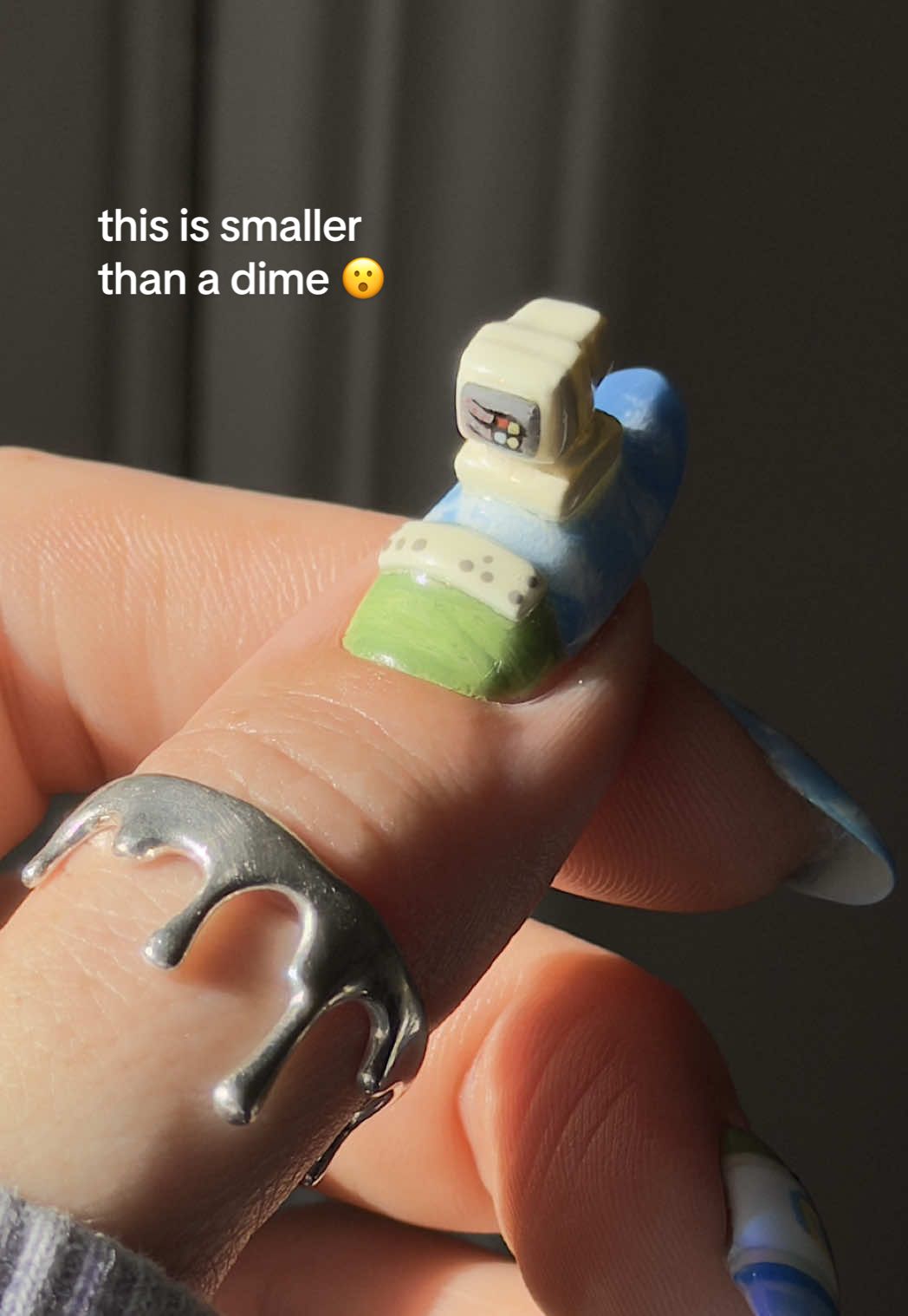 TikTok post by @thegraytergood for Windows. Caption reads: #ad // hellooooo 3D mini nails for @Windows !!....