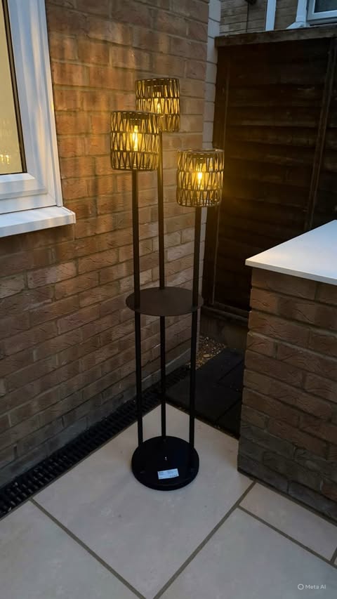 Instagram post by @athomewiththecollins for Aosom. Caption reads: [...] this beautiful outdoor floor lamp from Aosom....