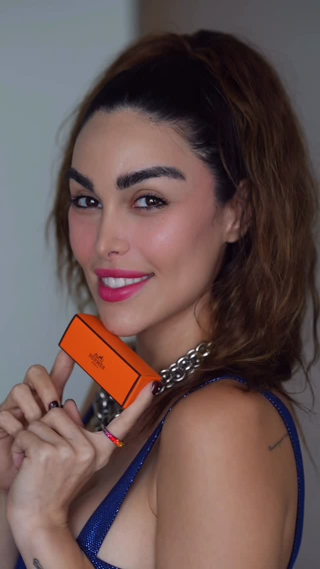 Instagram post by @parmidamamaghani for Hermès. Caption reads: @hermes 

#RougeHermes #Beauty|sAGesture....