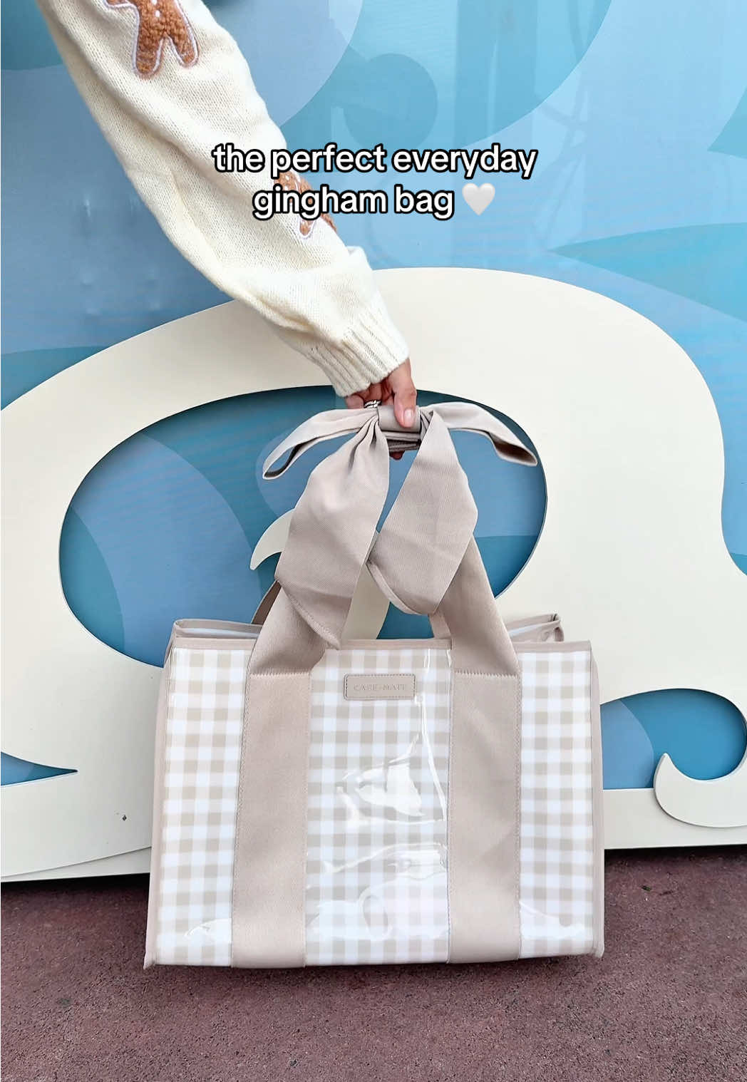 TikTok post by @andrea_parkerson for Case-Mate. Caption reads: This print & bow is everything!!! 😍🤍 @Case-Mate....