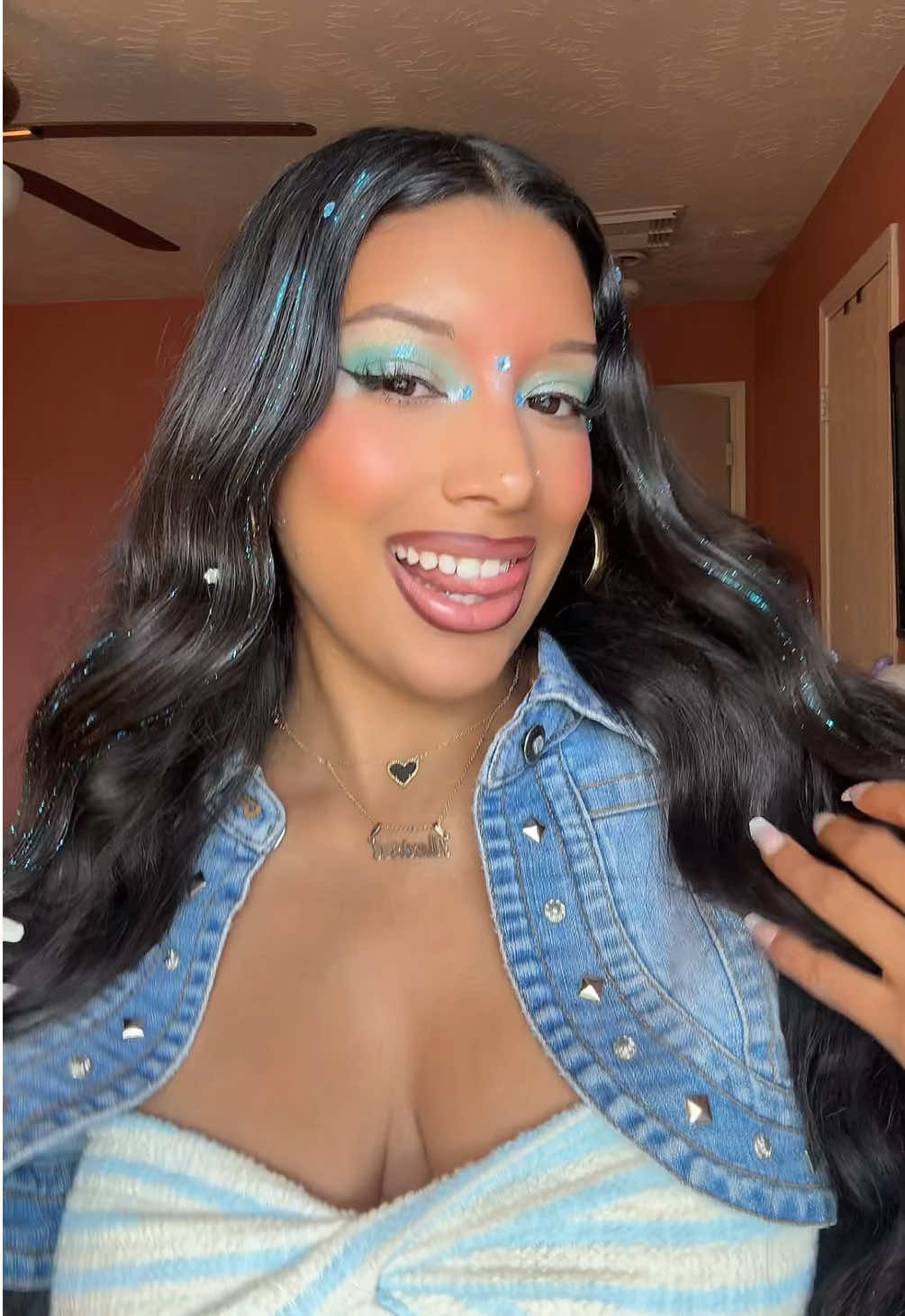 TikTok post by @lexichavezzz for Hally Hair. Caption reads: [...] gems and blue glitter shade stix from @Hally....