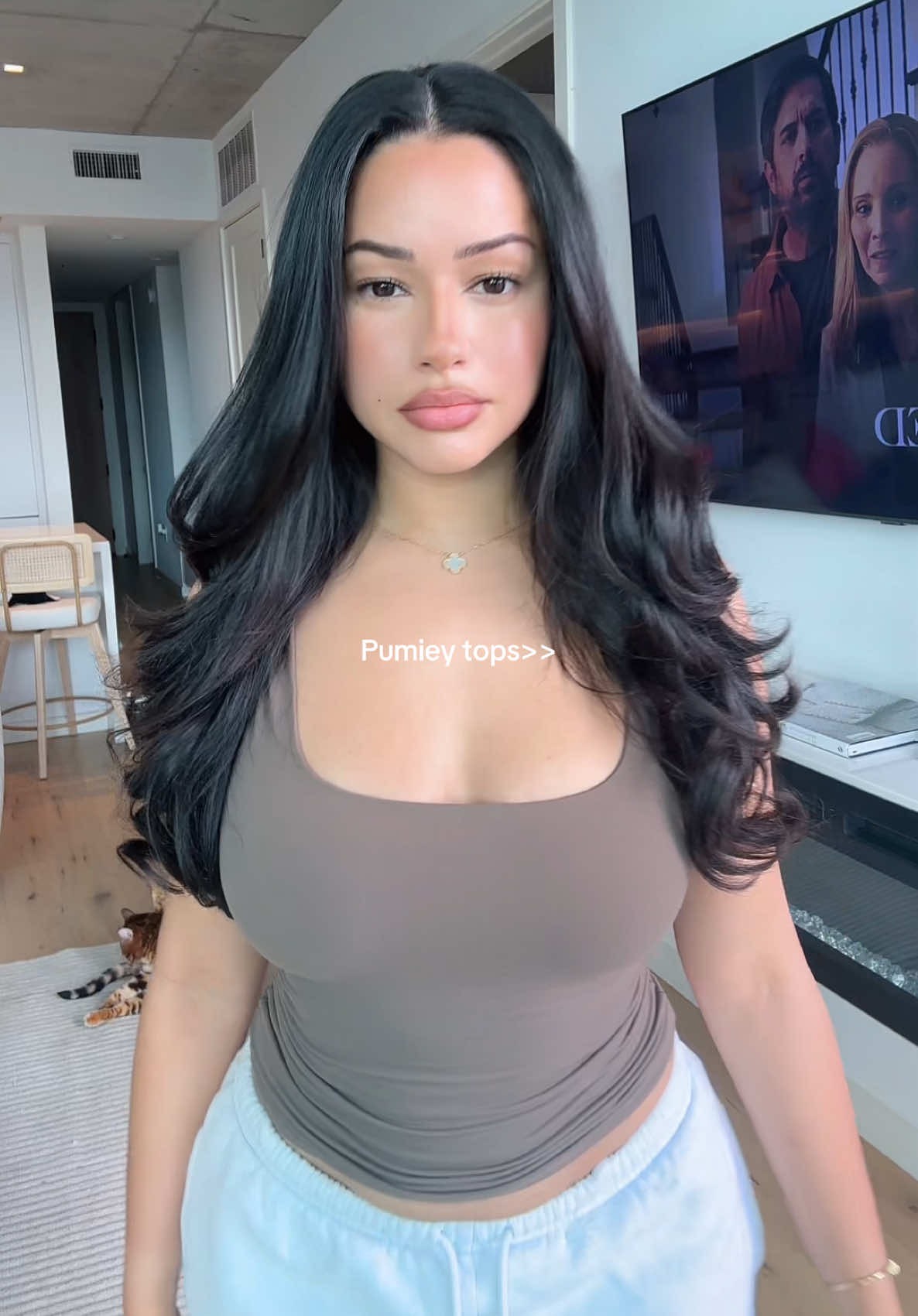 TikTok post by @farahmlkk for PUMIEY. Caption reads: @PUMIEY has the best basic tops 🤎.