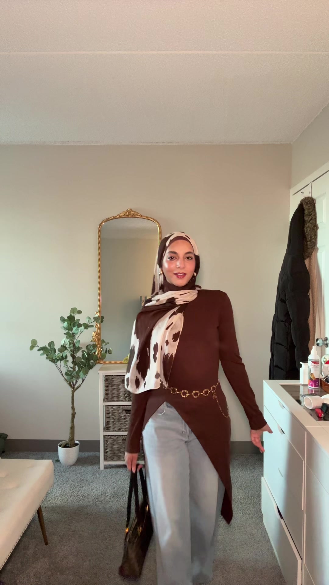 TikTok post by @luluyousefff for VELA. Caption reads: [...] #ootd #brown #goldchain #tiktokshopdeals....