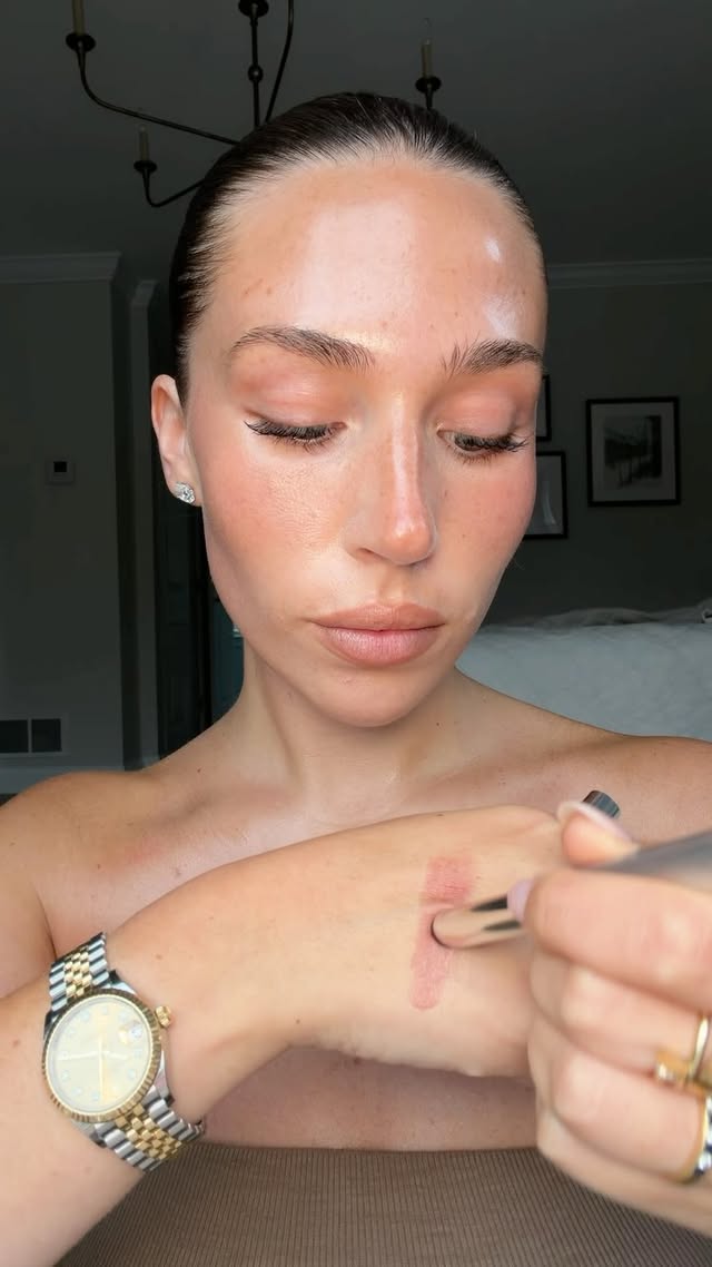 Instagram post by @livmanni for Clinique. Caption reads: Clinique almost lipstick in black honey - a [...].