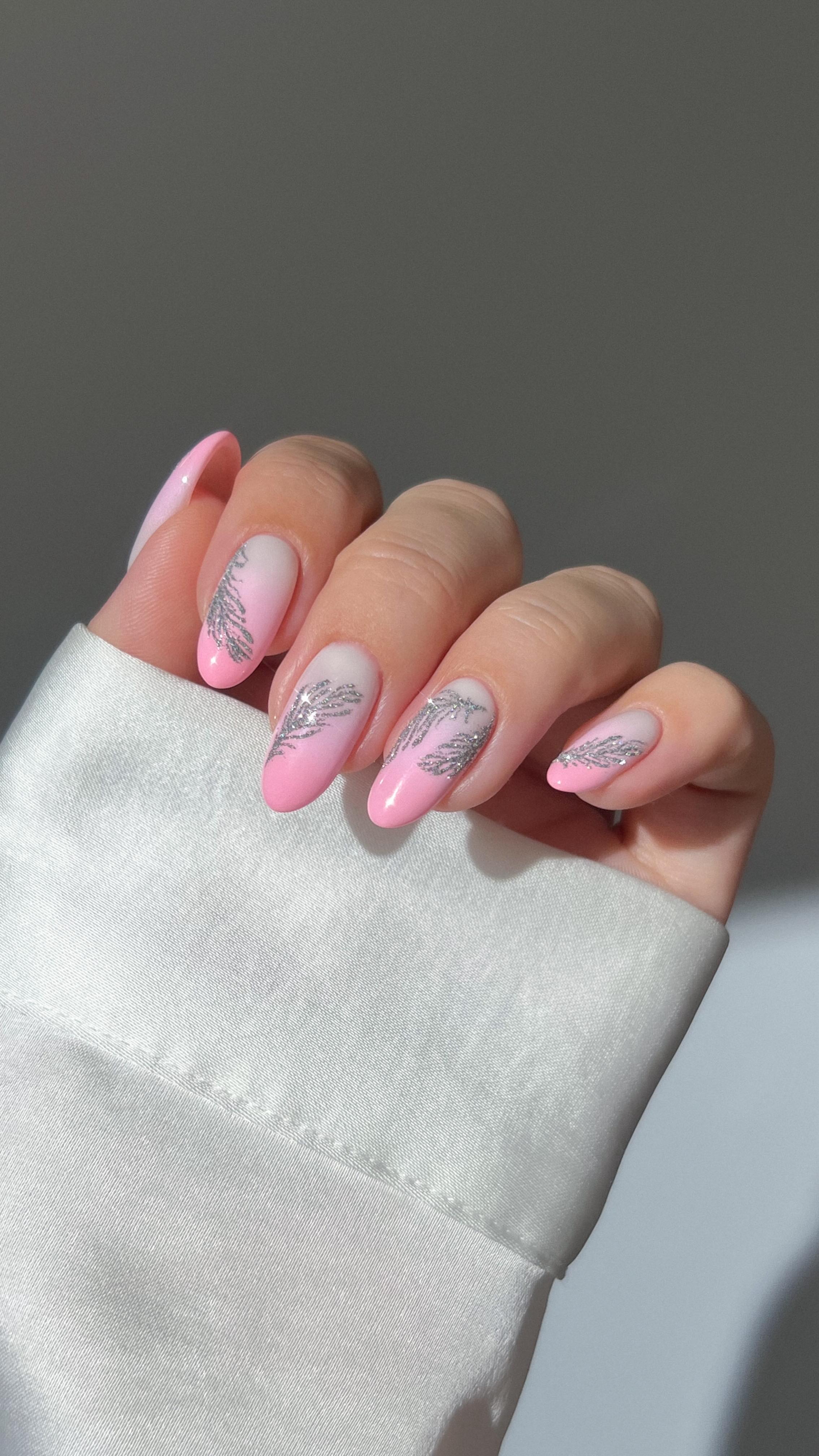 Instagram post by @heygreatnails for SWAROVSKI. Caption reads: 🦢💗 sparkles, feathers, and soft pink glam....