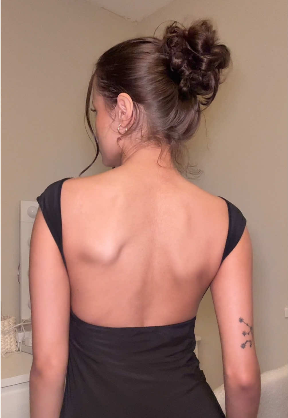 TikTok post by @paigeemariee for Rebellious Fashion. Caption reads: backless dress >>  @Rebellious Fashion @Rebellious....
