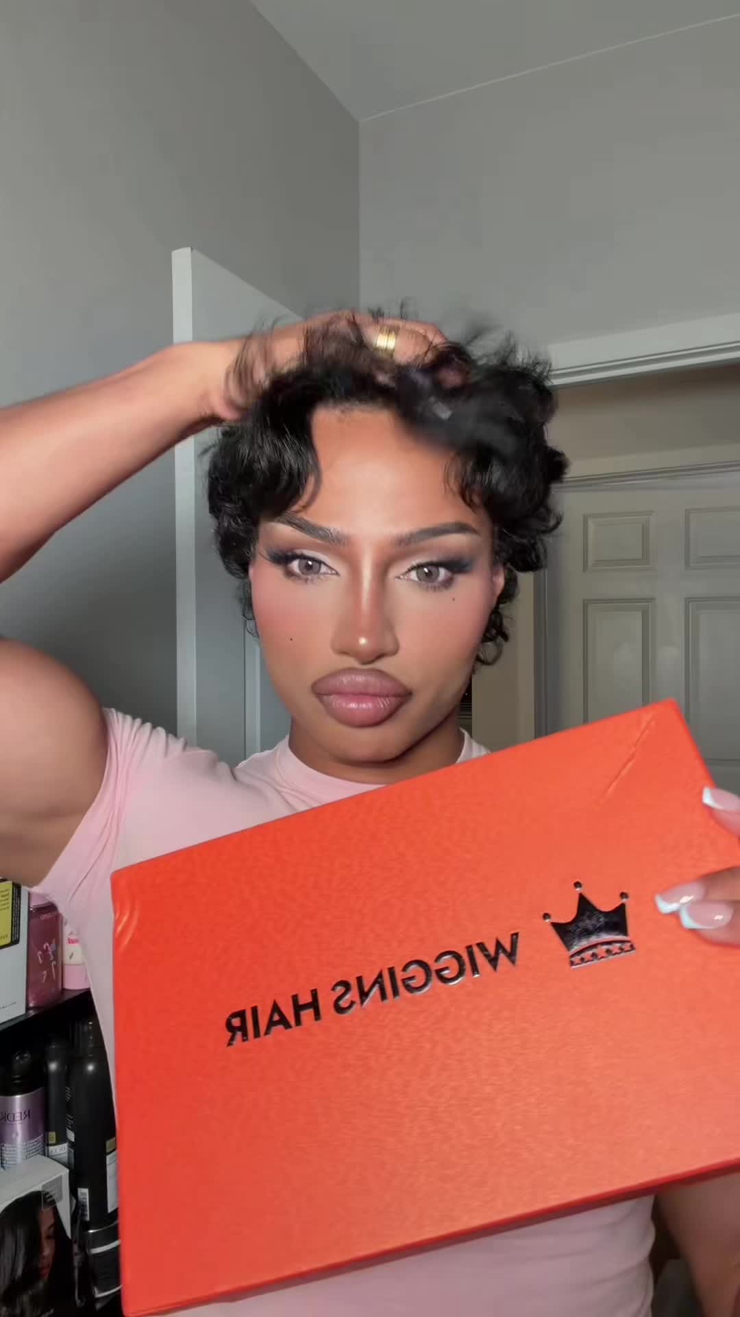 TikTok post by @glambyjerr for Wiggins Hair. Caption reads: @Wiggins Hair Store curl with a side part 😍 i....