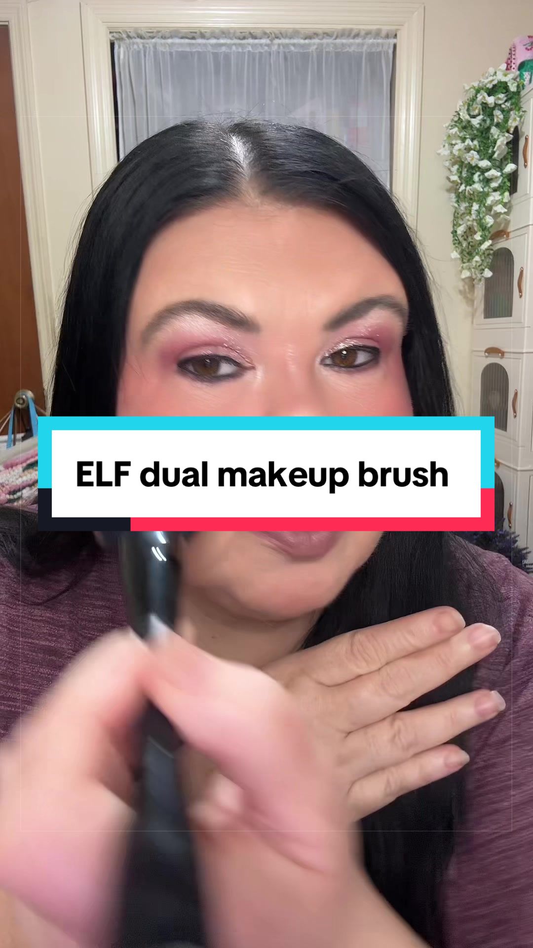 TikTok post by an influencer for e.l.f. Cosmetics. Caption reads: [...] ended makeup brush from @e.l.f. Cosmetics....