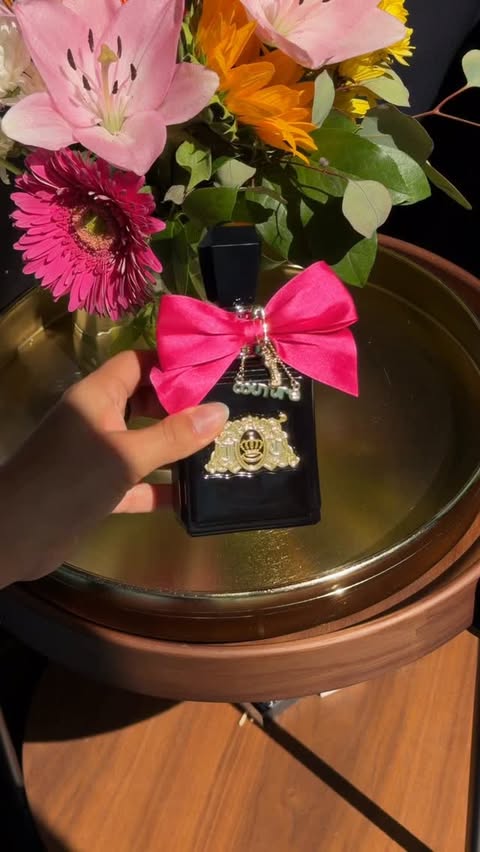 Instagram post by @yvehernandz for Juicy Couture. Caption reads: [...] ✨🤍 #VivaLaJuicyElixir @juicycouture....