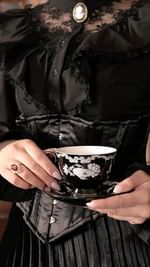 Instagram post by @draculelle for Petals and Poison. Caption reads: [...] Lucerna tea cup and strainer from....