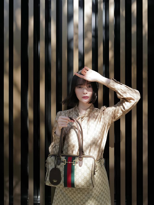 Instagram post by @tinapouty for GUCCI. Caption reads: [...] @GUCCI #Gucci #GucciBorsetto.