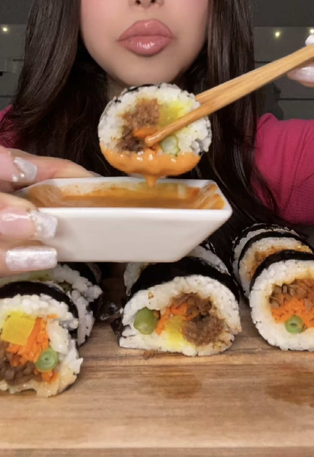 TikTok post by @isabelvangx for hiyo. Caption reads: Bulgogi gimbap mukbang ♥️ Paired with @drink hiyo....