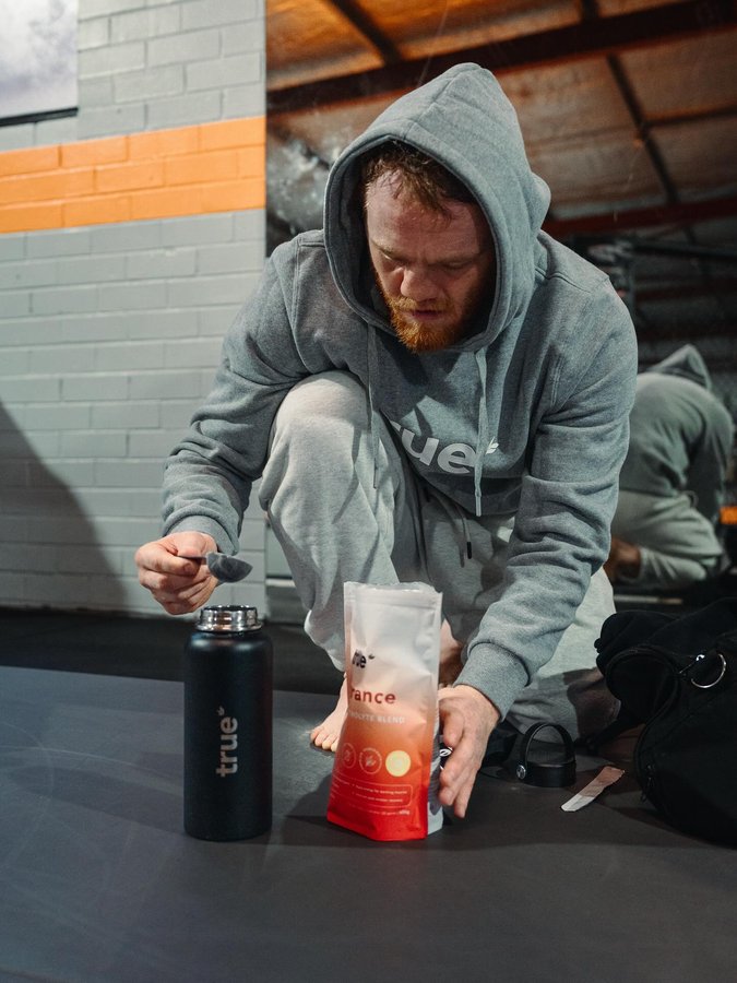 Instagram post by @jackdellamaddalena for True Protein. Caption reads: @trueprotein always essential in the daily grind..